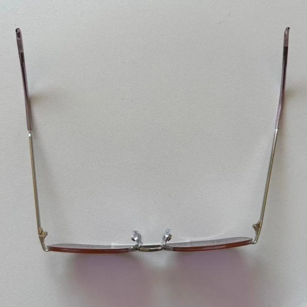 Gold aviator sunglasses with purple